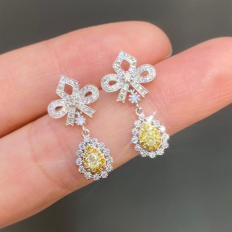 14k Gold 0.76 Ct Natural Color Diamond Earrings: Ref:231062102 // gold content:14k gold // main gemstone:diamond // shape:multiply // carat weight:0. 76ct // clarity grade:vs-si // color:color // treatment:natural // Condition: New Low Estimate: