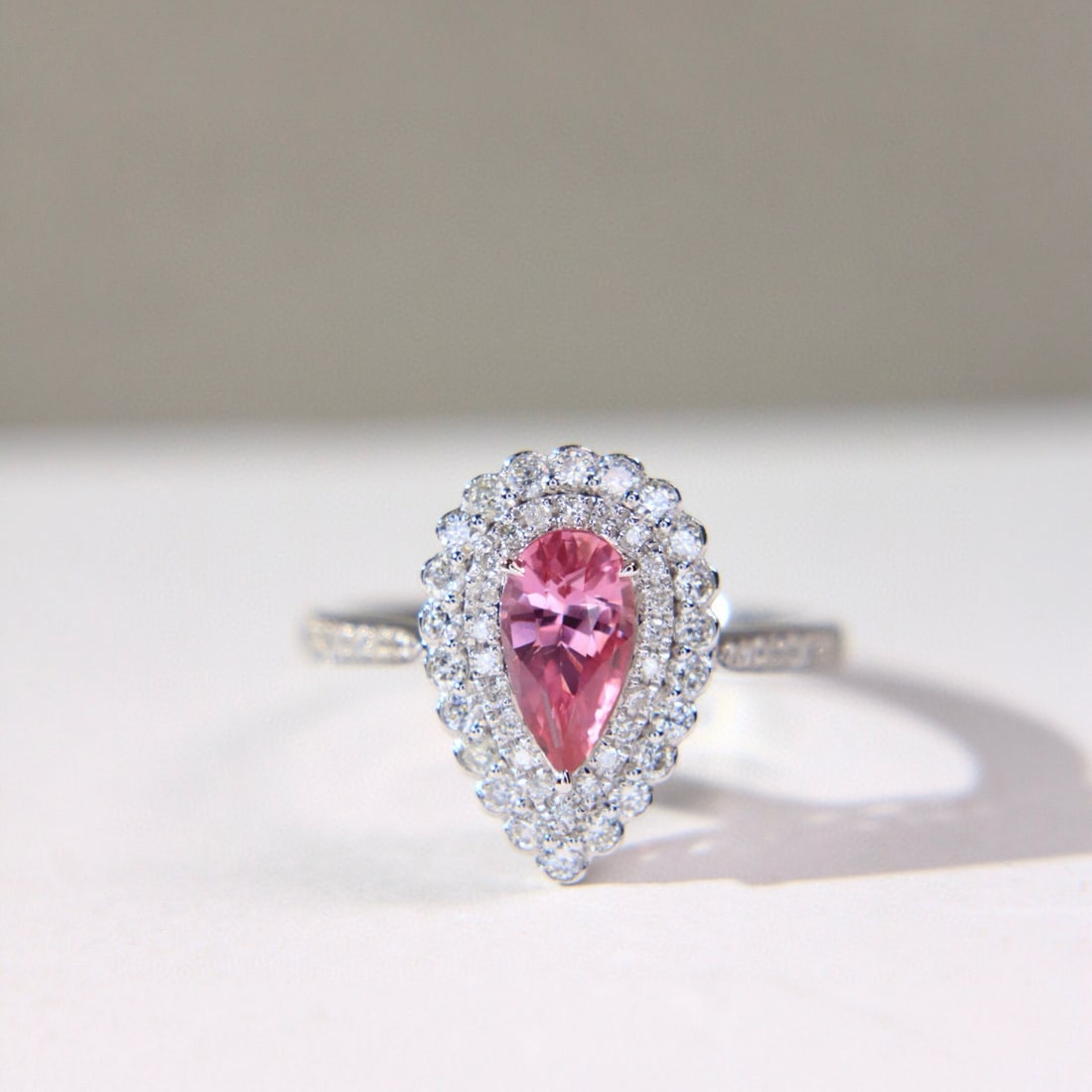 14k Gold 1.49 Ctw Natural Padparadscha Sapphire & Diamond Ring: Ref:231062189 // gold content:14k gold // ring size:7. 25us // // main gemstone:padparadscha sapphire // shape:pear // carat weight:1. 03ct // color:orangish pink // treatment:natural // // adjacent