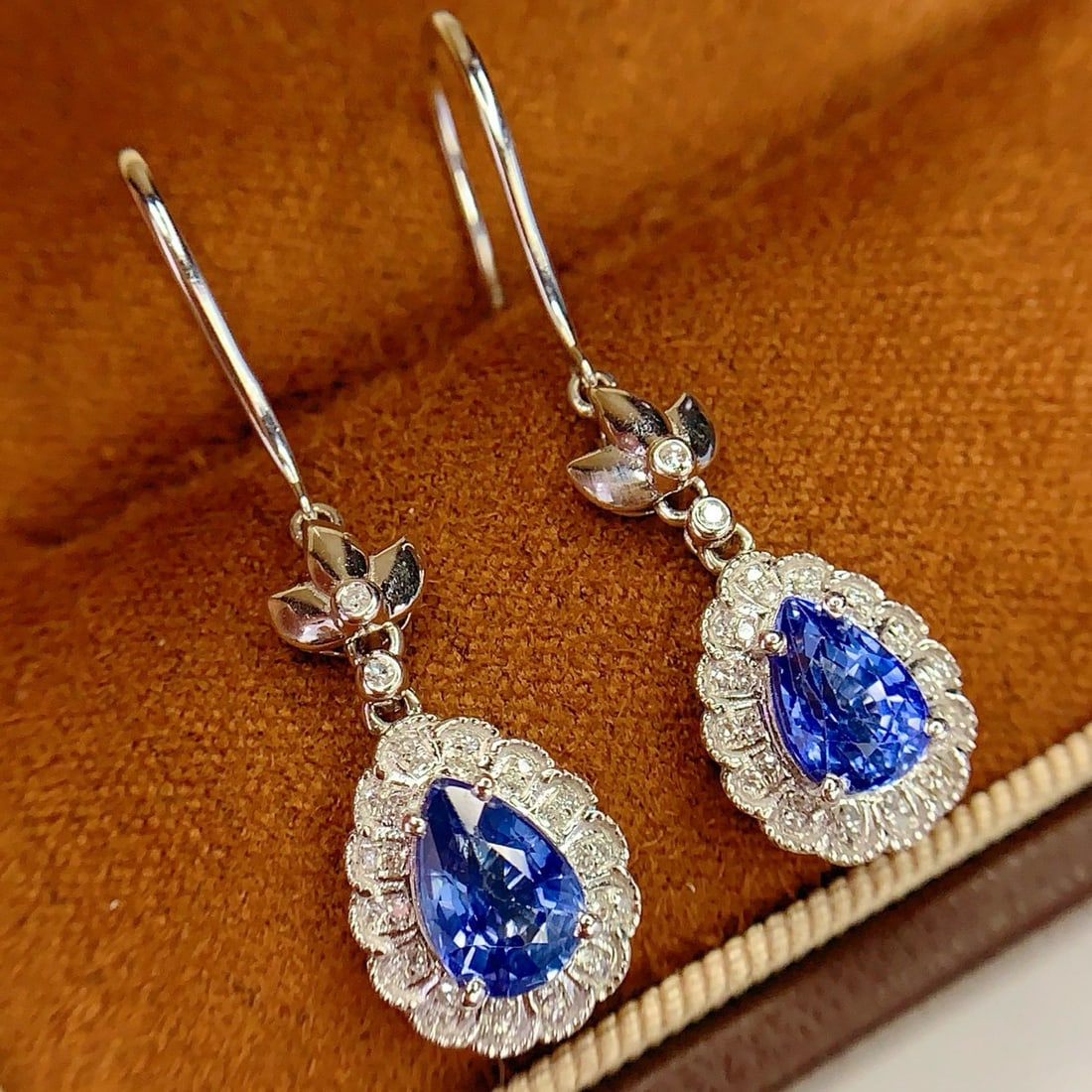 14k Gold 2.4 Ct Natural Sapphire & Diamond Earrings: Ref:231062256 // gold content:14k gold // main gemstone:sapphire // shape:pear // carat weight:2. 4ct // color:blue // treatment:natural // // adjacent gemstone 2 : diamond // number of stones:60 // s