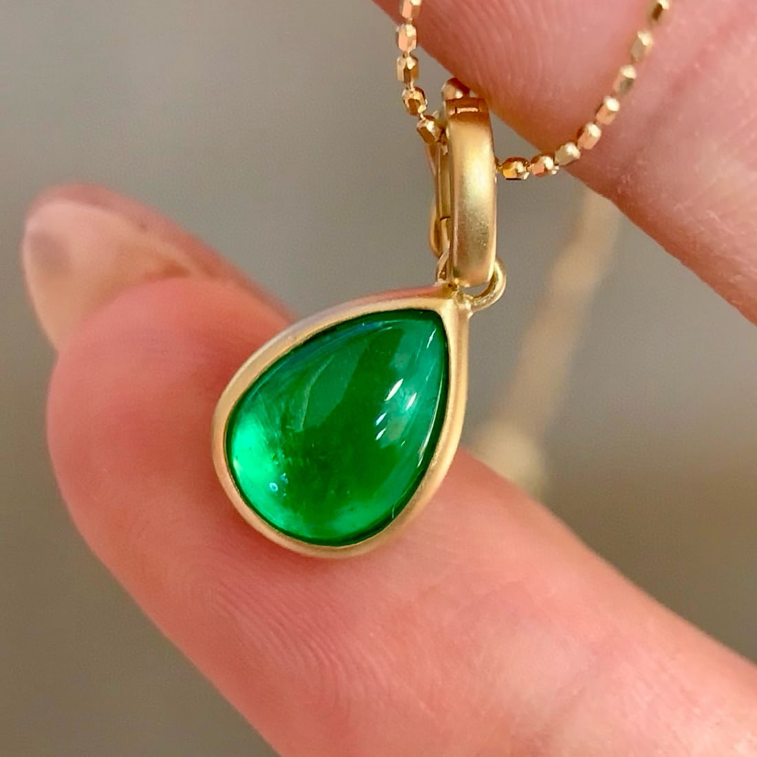 14k Gold 1.15 Ct Vivid Green Natural Emerald Pendant( Without Chain ): Ref:231062357 // gold content:14k gold // main gemstone:emerald // shape:pear // carat weight:1. 15ct // color:vivid green // treatment:natural // Condition: New Low Estimate: 2900.00 High Estimate: