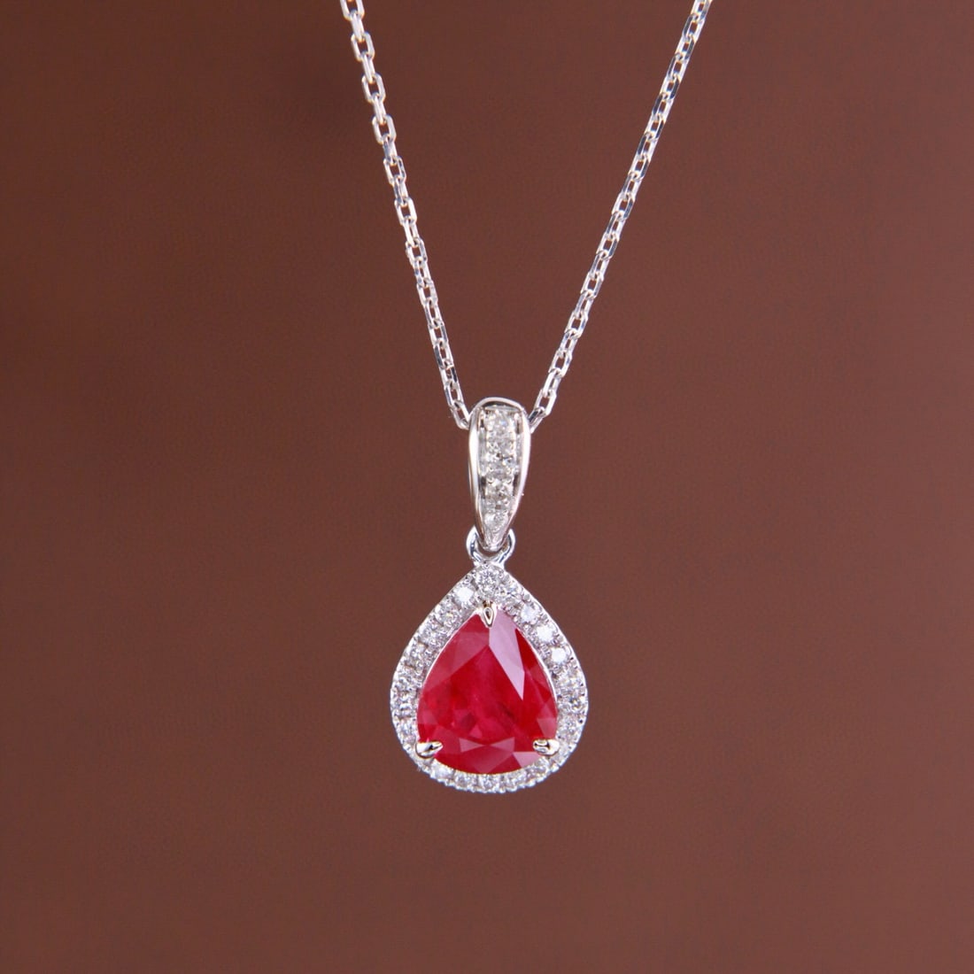 14k Gold 1.24 Ctw Natural Ruby & Diamond Pendant( Without Chain ): Ref:231062414 // gold content:14k gold // main gemstone:ruby // shape:pear // carat weight:1. 11ct // color:pigeonblood red // treatment:natural // // adjacent gemstone 2 : diamond // shape:round //