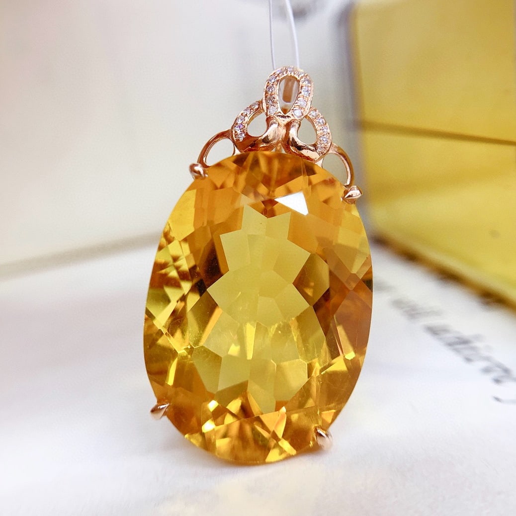 14k Gold 26.85 Ct Natural Citrine & Diamond Pendant( Without Chain ): Ref:231063019 // gold content:14k gold // main gemstone:citrine // shape:oval // carat weight:26. 85ct // color:yellow // treatment:natural // // adjacent gemstone 2 : diamond // number of stones:21