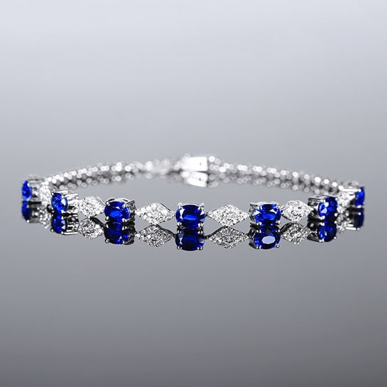 14k Gold 2.81 Ctw Natural Sapphire & Diamond Bracelet: Ref:231063104 // gold content:14k gold // main gemstone:sapphire // shape:oval // carat weight:2. 48ct // color:blue // treatment:natural // // adjacent gemstone 2 : diamond // number of stones:112
