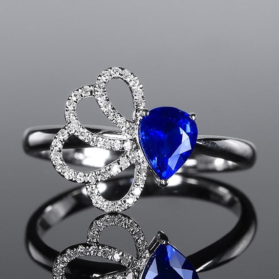 14k Gold 0.85 Ctw Natural Sapphire & Diamond Ring: Ref:231064003 // gold content:14k gold // ring size:7. 25us // // main gemstone:sapphire // shape:pear // carat weight:0. 73ct // color:royal blue // treatment:natural // // adjacent gemstone 2 :