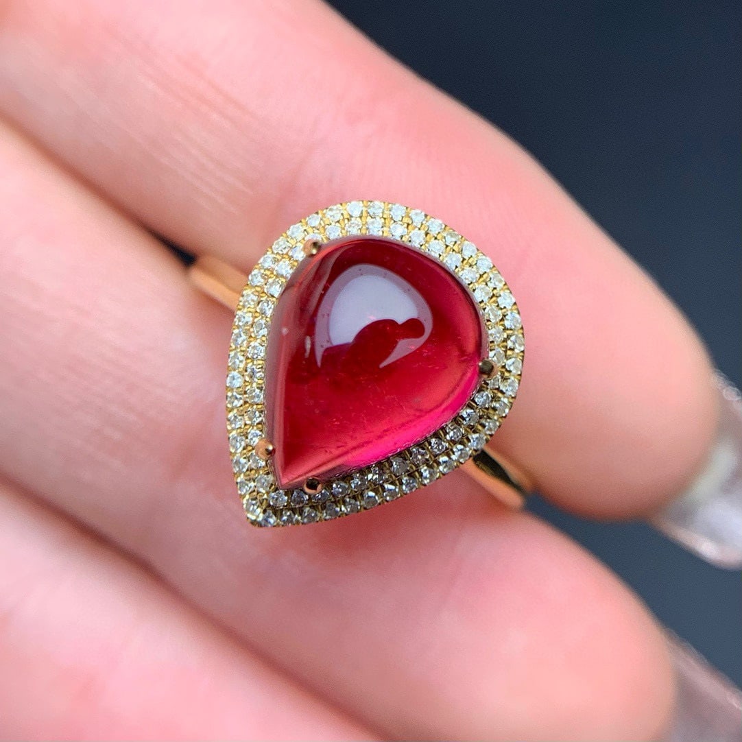 14k Gold 4.3 Ct Natural Tourmaline & Diamond Ring: Ref:231064340 // gold content:14k gold // ring size:7. 25us // // main gemstone:tourmaline // shape:pear // carat weight:4. 3ct // color:red // treatment:natural // // adjacent gemstone 2 : diamond