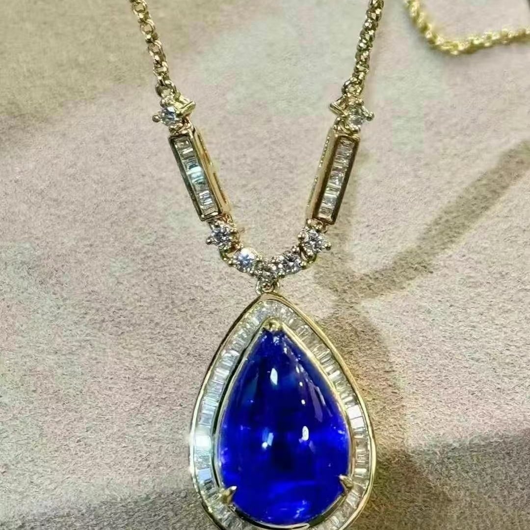 14k Gold 8.14 Ctw Natural Tanzanite & Diamond Necklace: Ref:231064406 // gold content:14k gold // main gemstone:tanzanite // shape:pear // carat weight:7. 66ct // color:blue // treatment:natural // // adjacent gemstone 2 : diamond // shape:multiply //
