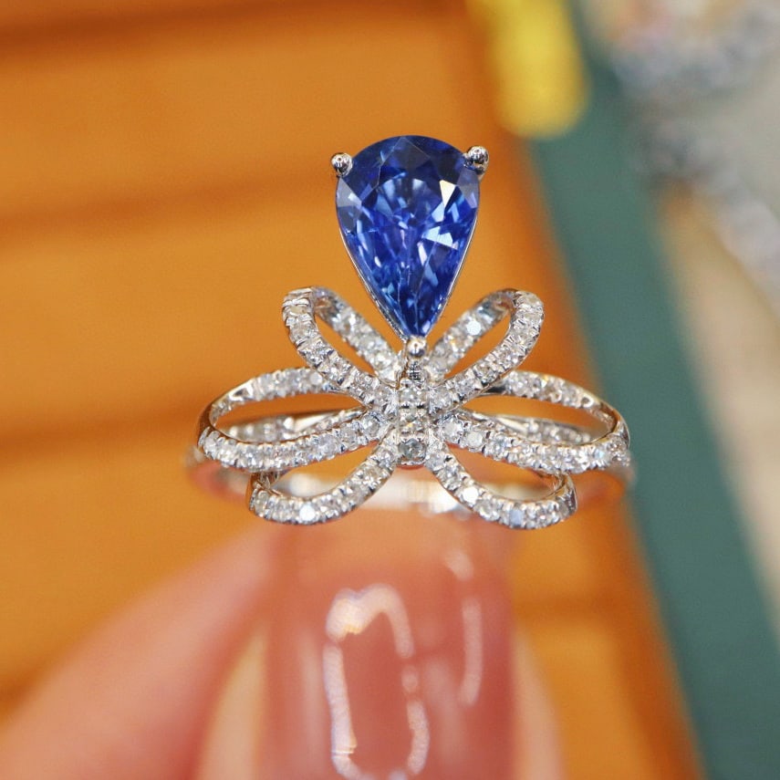 14k Gold 1.62 Ctw Natural Sapphire & Diamond Ring: Ref:231064437 // gold content:14k gold // ring size:7. 25us // // main gemstone:sapphire // shape:pear // carat weight:1. 38ct // color:cornflower blue // treatment:natural // // adjacent gemstone 2