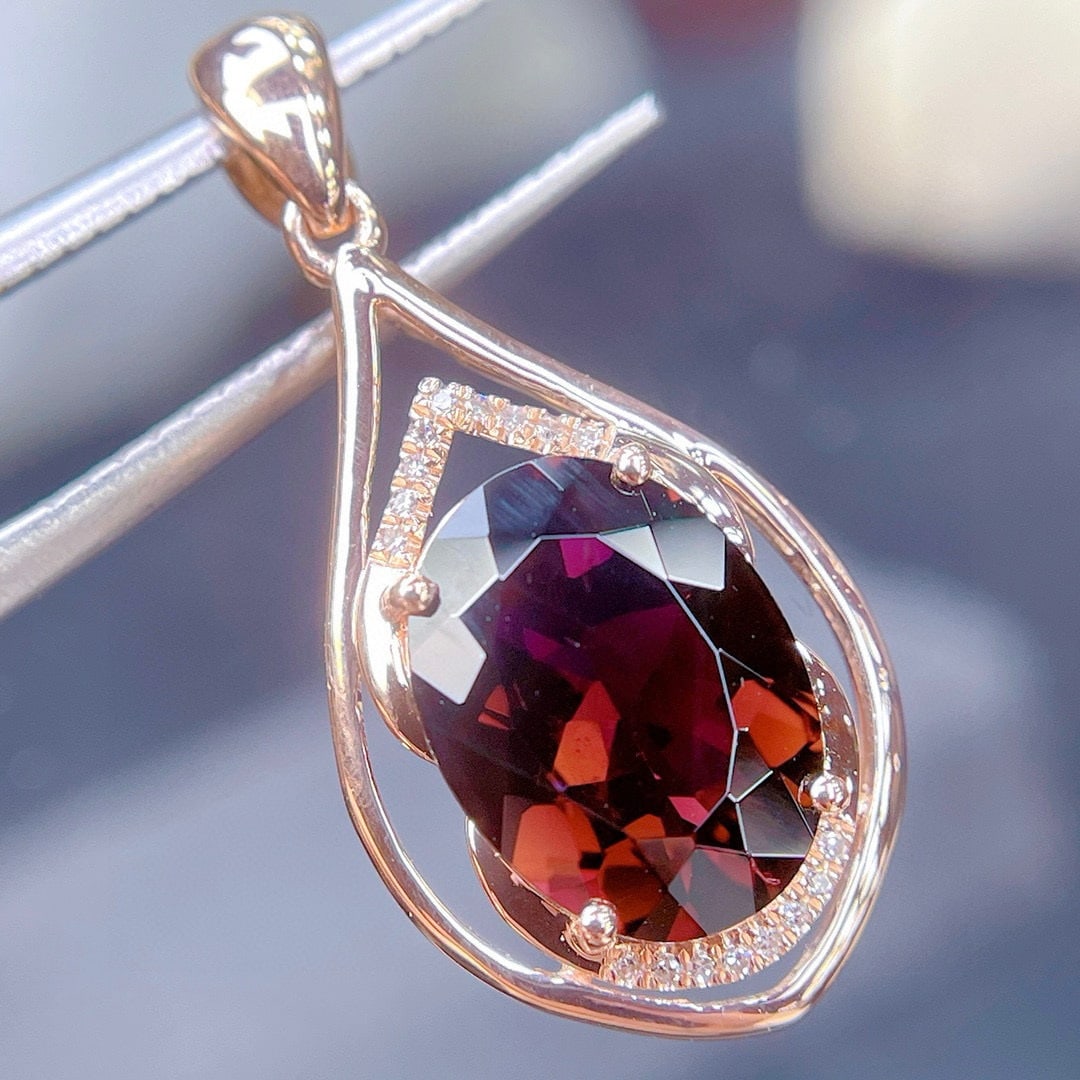14k Gold 2.8 Ct Natural Tourmaline & Diamond Pendant( Without Chain ): Ref:231064448 // gold content:14k gold // main gemstone:tourmaline // shape:oval // carat weight:2. 8ct // color:red // treatment:natural // // adjacent gemstone 2 : diamond // shape:round // clarity