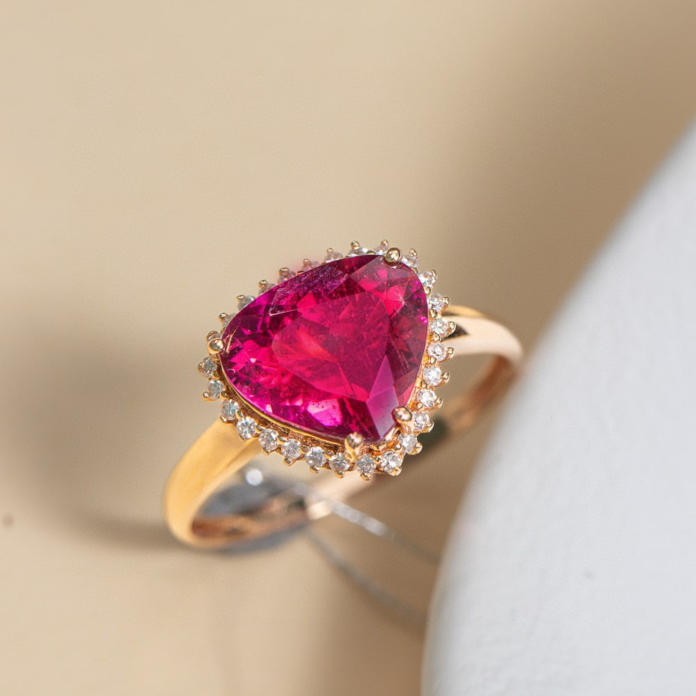 14k Gold 2.83 Ctw Natural Tourmaline & Diamond Ring: Ref:231066085 // gold content:14k gold // ring size:7. 25us // // main gemstone:tourmaline // shape:pear // carat weight:2. 55ct // color:red // treatment:natural // // adjacent gemstone 2 : diamond
