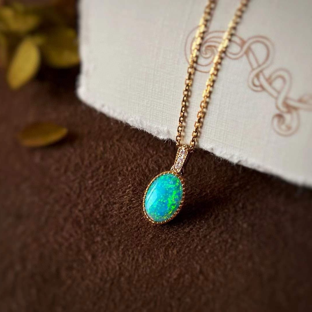 14k Gold 0.5 Ct Natural Opal & Diamond Pendant( Without Chain ): Ref:231066427 // gold content:14k gold // main gemstone:opal // shape:oval // carat weight:0. 5ct // color:color // treatment:natural // // adjacent gemstone 2 : diamond // shape:round // clarity grad