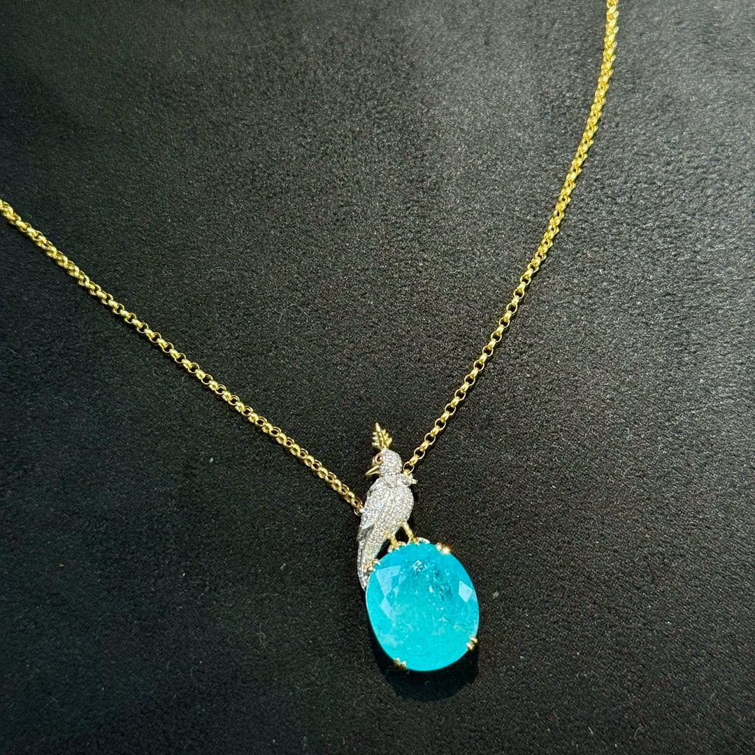 14k Gold 7.65 Ctw Natural Paraiba Tourmaline & Diamond Necklace: Ref:231067128 // gold content:14k gold // main gemstone:paraiba tourmaline // shape:oval // carat weight:7. 42ct // color:blue // treatment:natural // // adjacent gemstone 2 : diamond // shape:round /