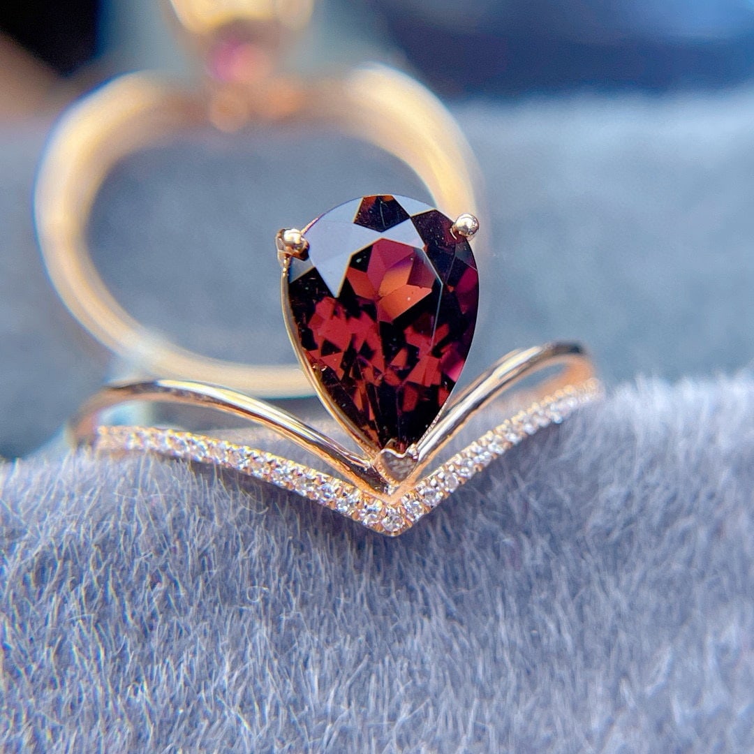 14k Gold 1.75 Ct Natural Tourmaline & Diamond Ring: Ref:231068103 // gold content:14k gold // ring size:7. 25us // // main gemstone:tourmaline // shape:pear // carat weight:1. 75ct // color:red // treatment:natural // // adjacent gemstone 2 : diamond
