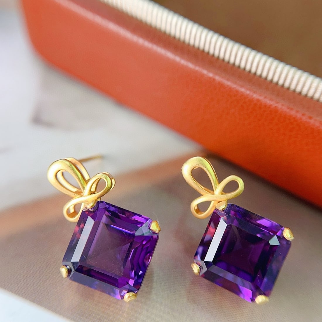 14k Gold 11.80 Ct Natural Amethyst Earrings: Ref:231068136 // gold content:14k gold // main gemstone:amethyst // shape:octagonal // carat weight:11. 80ct // color:purple // treatment:natural // Condition: New Low Estimate: 1800.00 High