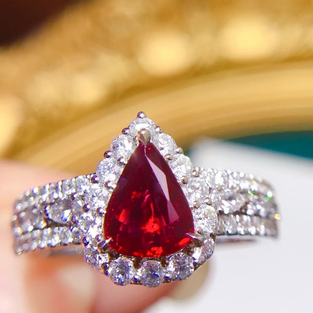 14k Gold 1.89 Ctw Natural Ruby & Diamond Ring: Ref:231068154 // gold content:14k gold // ring size:7. 25us // // main gemstone:ruby // shape:pear // carat weight:1. 02ct // color:pigeonblood red // treatment:natural // // adjacent gemstone 2 :