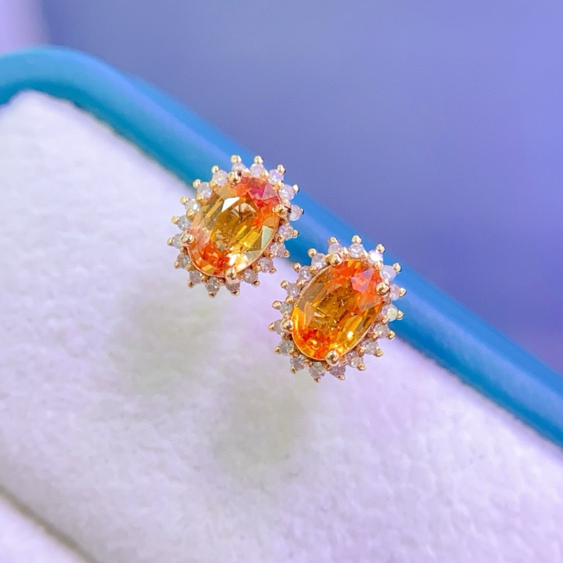 14k Gold 1.33 Ctw Natural Sapphire & Diamond Earrings: Ref:231068192 // gold content:14k gold // main gemstone:sapphire // shape:oval // carat weight:1. 15ct // color:orange // treatment:natural // // adjacent gemstone 2 : diamond // number of stones:36