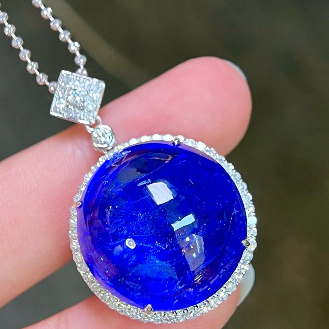 14k Gold 50.76 Ctw Natural Tanzanite & Diamond Pendant( Without Chain ): Ref:231069088 // gold content:14k gold // main gemstone:tanzanite // shape:round // carat weight:50. 08ct // color:blue // treatment:natural // cut grade:g // // adjacent gemstone 2 : diamond //