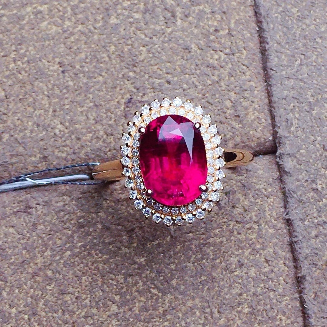 14k Gold 2.7 Ct Natural Tourmaline & Diamond Ring: Ref:231070078 // gold content:14k gold // ring size:7. 25us // // main gemstone:tourmaline // shape:oval // carat weight:2. 7ct // color:red // treatment:natural // // adjacent gemstone 2 : diamond