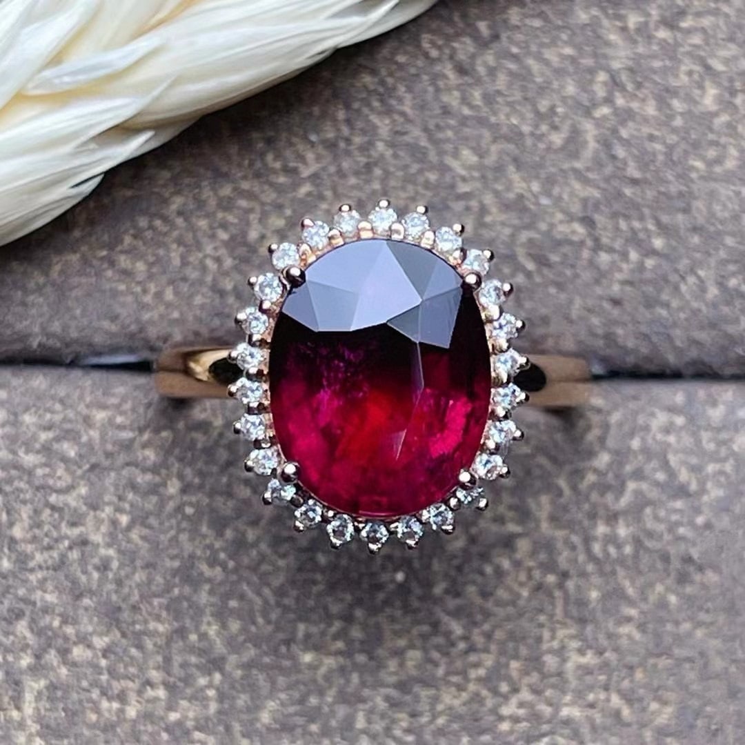 14k Gold 4.15 Ct Natural Tourmaline & Diamond Ring: Ref:231070126 // gold content:14k gold // ring size:7. 25us // // main gemstone:tourmaline // shape:oval // carat weight:4. 15ct // color:red // treatment:natural // // adjacent gemstone 2 : diamond /