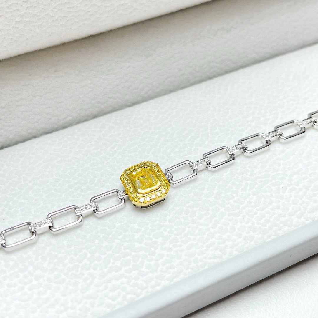 14k Gold 0.77 Ctw Natural Yellow Diamond & Diamond Bracelet: Ref:231070274 // gold content:14k gold // main gemstone:yellow diamond // shape:emerald // carat weight:0. 50ct // color:yellow // treatment:natural // // adjacent gemstone 2 : diamond // shape:round