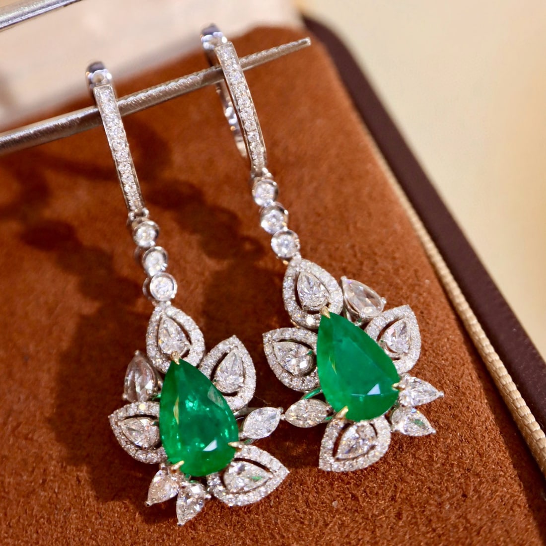 14k Gold 5.30 Ctw Vivid Green Natural Emerald & Diamond Earrings: Ref:231070383 // gold content:14k gold // main gemstone:emerald // shape:pear // carat weight:3. 29ct // color:vivid green // treatment:natural // // adjacent gemstone 2 : diamond // shape:multiple //