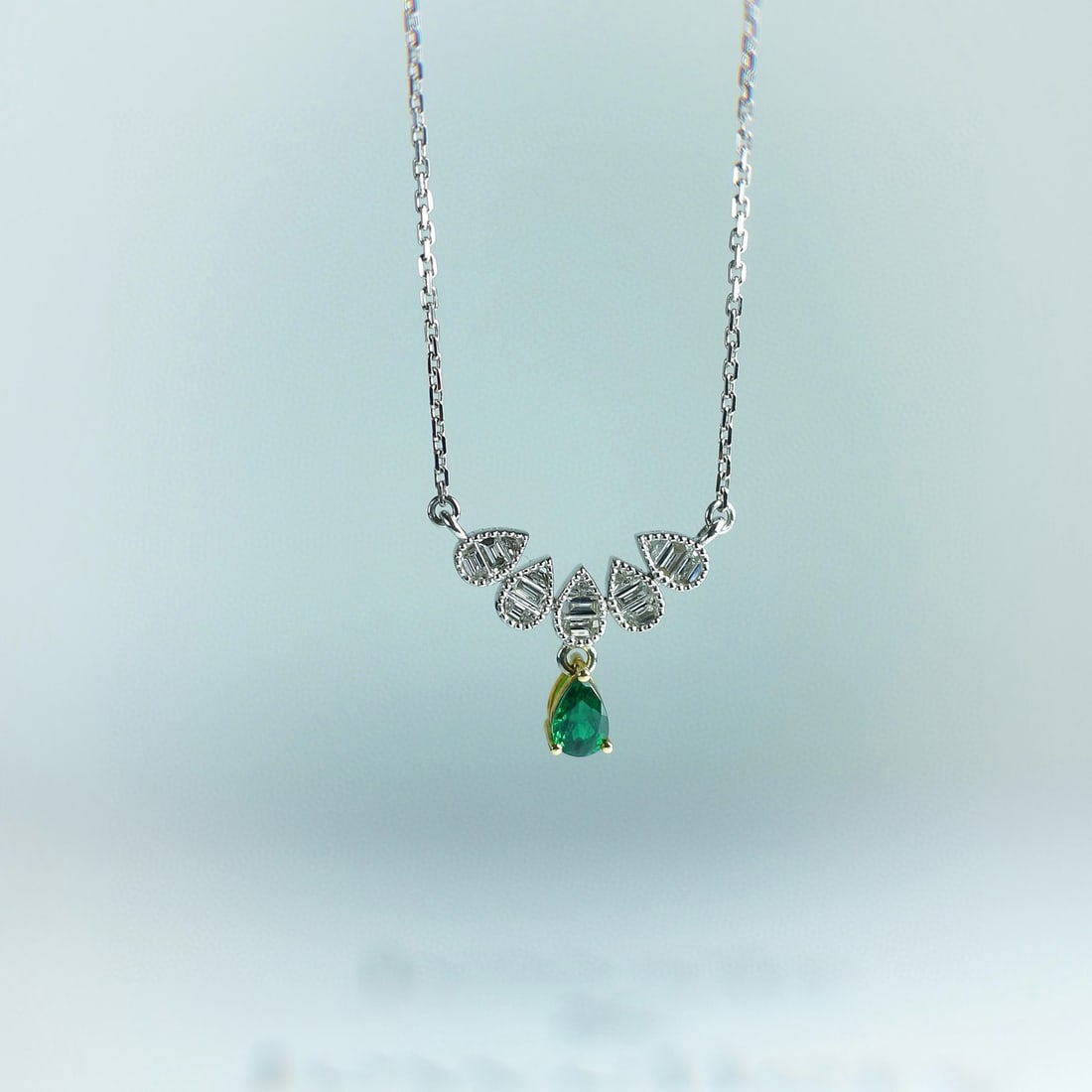 14k Gold 0.63 Ctw Vivid Green Natural Emerald & Diamond Necklace: Ref:231070441 // gold content:14k gold // main gemstone:emerald // shape:pear // carat weight:0. 29ct // color:vivid green // treatment:natural // // adjacent gemstone 2 : diamond // shape:baguette
