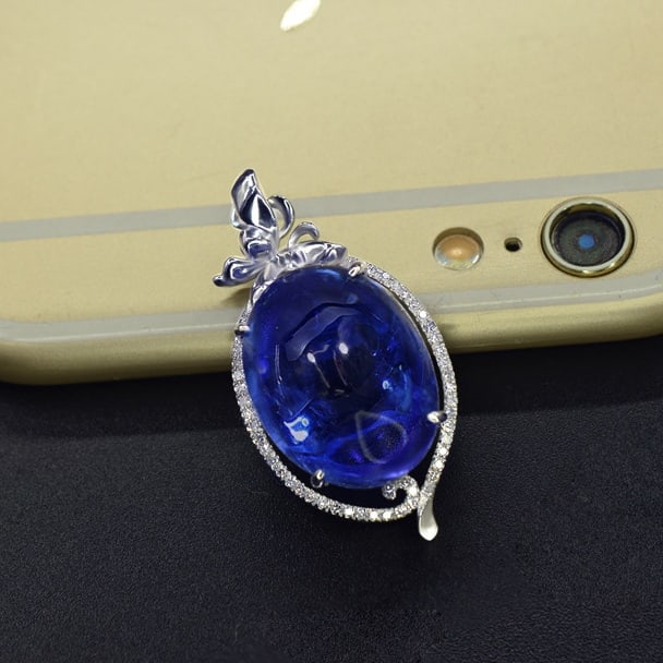 14k Gold 16.53 Ctw Natural Tanzanite & Diamond Pendant( Without Chain ): Ref:231071012 // gold content:14k gold // main gemstone:tanzanite // shape:oval // carat weight:16. 39ct // color:blue // treatment:natural // // adjacent gemstone 2 : diamond // number of stones:47