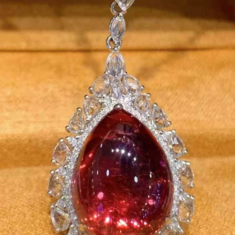 14k Gold 10.7 Ct Natural Tourmaline & Diamond & Sapphire Pendant( Without Chain ): Ref:231071048 // gold content:14k gold // main gemstone:tourmaline // shape:pear // carat weight:10. 7ct // color:red // treatment:natural // // adjacent gemstone 2 : diamond // shape:round //