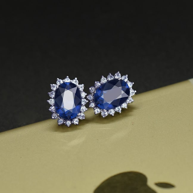 14k Gold 2.92 Ctw Natural Sapphire & Sapphire Earrings: Ref:231071059 // gold content:14k gold // main gemstone:sapphire // shape:oval // carat weight:2. 36ct // color:blue // treatment:natural // // adjacent gemstone 2 : sapphire // shape:round // carat
