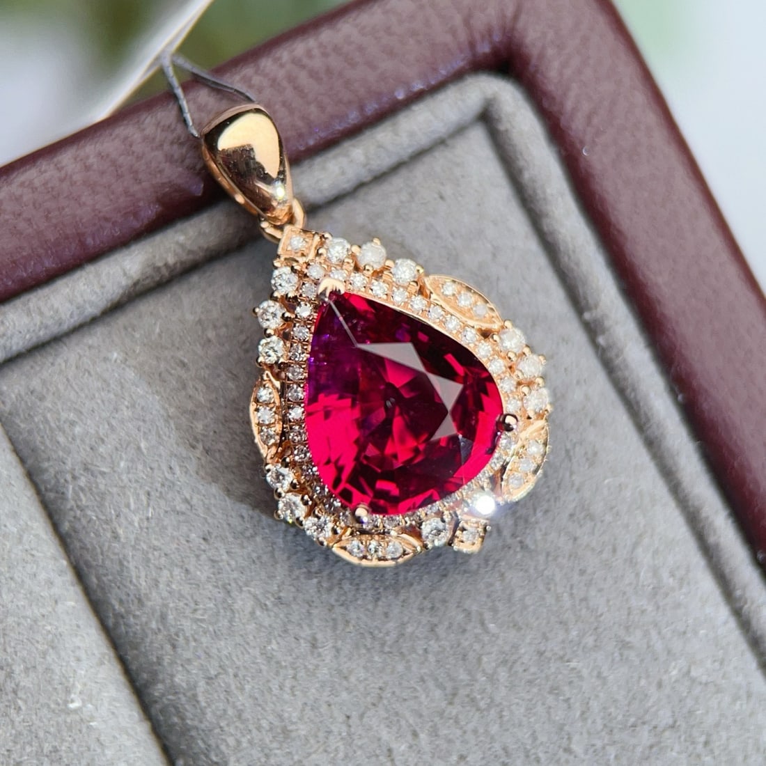14k Gold 2.78 Ctw Natural Tourmaline & Diamond Pendant( Without Chain ): Ref:231072045 // gold content:14k gold // main gemstone:tourmaline // shape:pear // carat weight:2. 49ct // color:red // treatment:natural // // adjacent gemstone 2 : diamond // number of stones:64