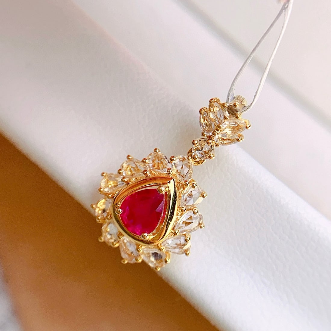 14k Gold 0.50 Ct Natural Ruby & Sapphire Pendant( Without Chain ): Ref:231072079 // gold content:14k gold // main gemstone:ruby // shape:pear // carat weight:0. 50ct // color:red // treatment:natural // // adjacent gemstone 2 : sapphire // number of stones:17 //