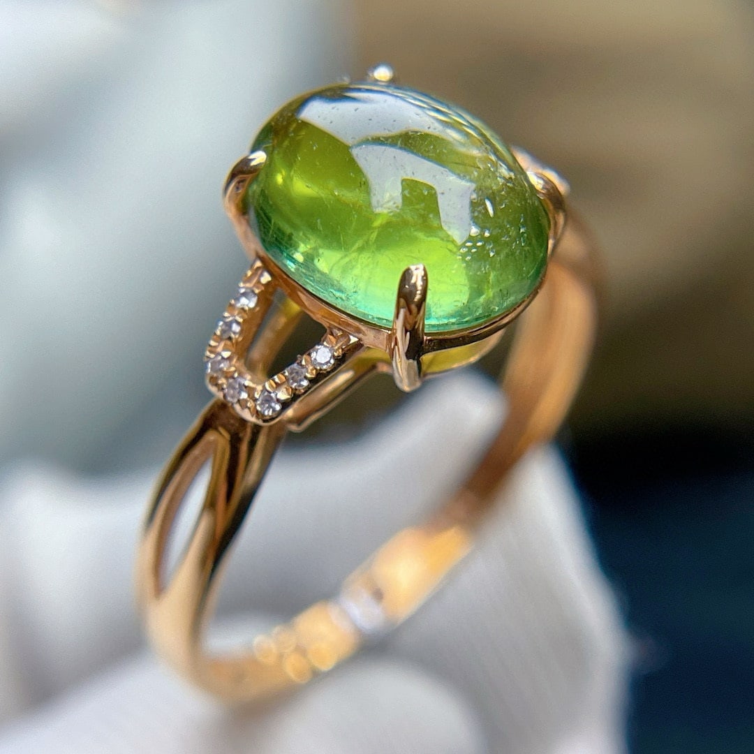 14k Gold 2.8 Ct Natural Tourmaline & Diamond Ring: Ref:231072147 // gold content:14k gold // ring size:7. 25us // // main gemstone:tourmaline // shape:oval // carat weight:2. 8ct // color:green // treatment:natural // // adjacent gemstone 2 : diamond