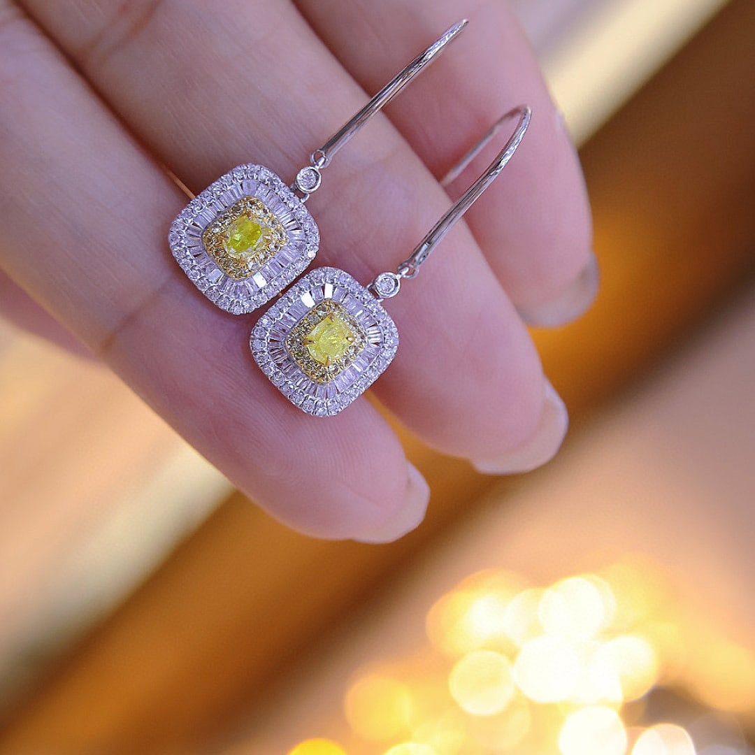 14k Gold 0.9 Ctw Natural Yellow Diamond & Diamond Earrings: Ref:231072168 // gold content:14k gold // main gemstone:yellow diamond // shape:oval // carat weight:0. 3ct // color:yellow // treatment:natural // // adjacent gemstone 2 : diamond // shape:multiple