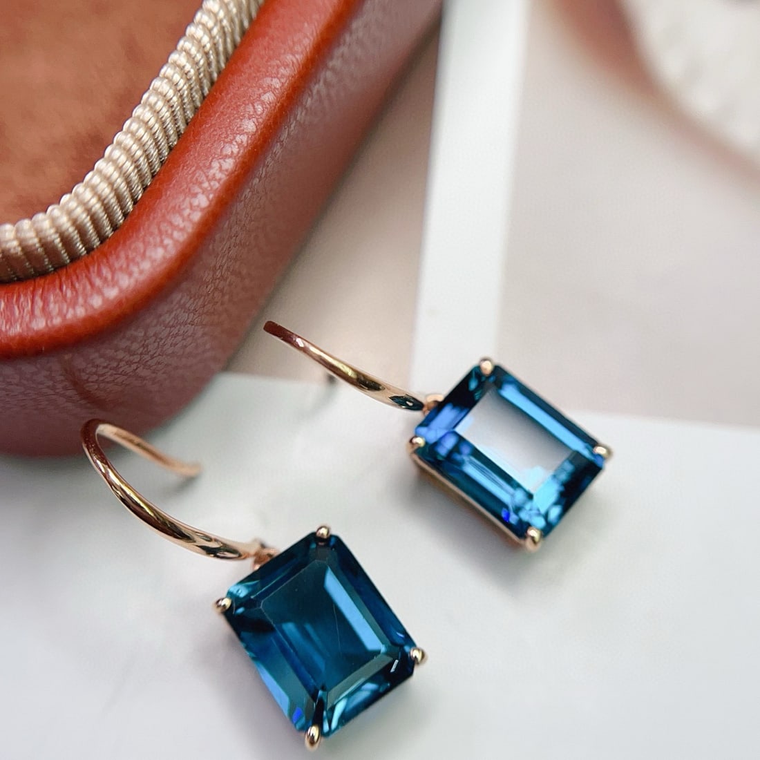 14k Gold 6.50 Ct Natural Topaz Earrings: Ref:231072258 // gold content:14k gold // main gemstone:topaz // shape:octagonal // carat weight:6. 50ct // color:blue // treatment:natural // Condition: New Low Estimate: 1300.00 High Estimate:
