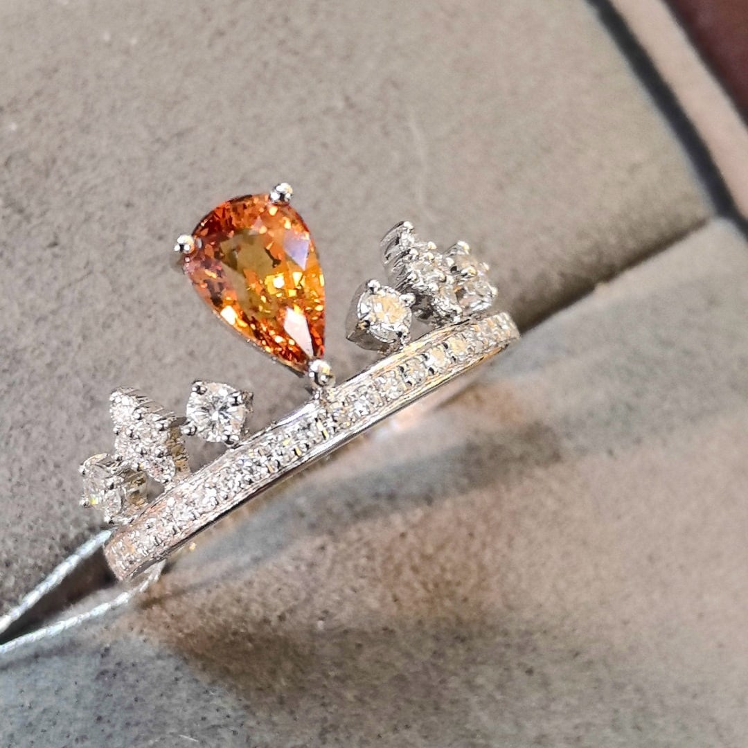 14k Gold 1.85 Ctw Natural Padparadscha Sapphire & Diamond Ring: Ref:231072270 // gold content:14k gold // ring size:7. 25us // // main gemstone:padparadscha sapphire // shape:pear // carat weight:1. 13ct // color:pinkish orange // treatment:natural // // adjacent