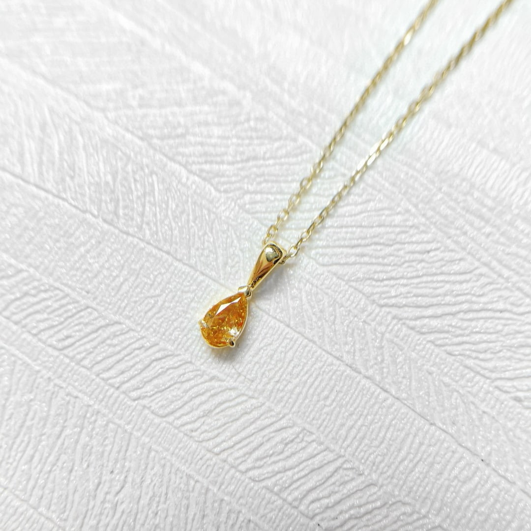 14k Gold 0.15 Ct Natural Orange Diamond Necklace: Ref:231072360 // gold content:14k gold // main gemstone:diamond // shape:pear // carat weight:0. 15ct // color:orange // treatment:natural // Low Estimate: 2600 High Estimate: 4000 Condition: New