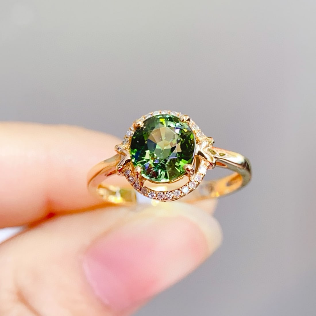 14k Gold 1.9 Ct Natural Tourmaline & Diamond Ring: Ref:231072430 // gold content:14k gold // ring size:7. 25us // // main gemstone:tourmaline // shape:oval // carat weight:1. 9ct // color:green // treatment:natural // // adjacent gemstone 2 : diamond 