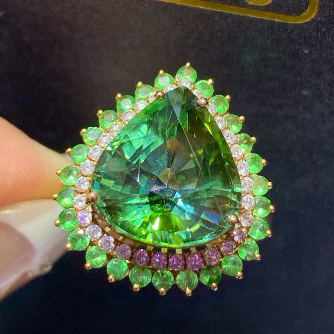 14k Gold 9.0 Ct Natural Tourmaline & Diamond Ring: Ref:231073012 // gold content:14k gold // ring size:7. 25us // // main gemstone:tourmaline // shape:pear // carat weight:9. 0ct // color:green // treatment:natural // // adjacent gemstone 2 : diamond