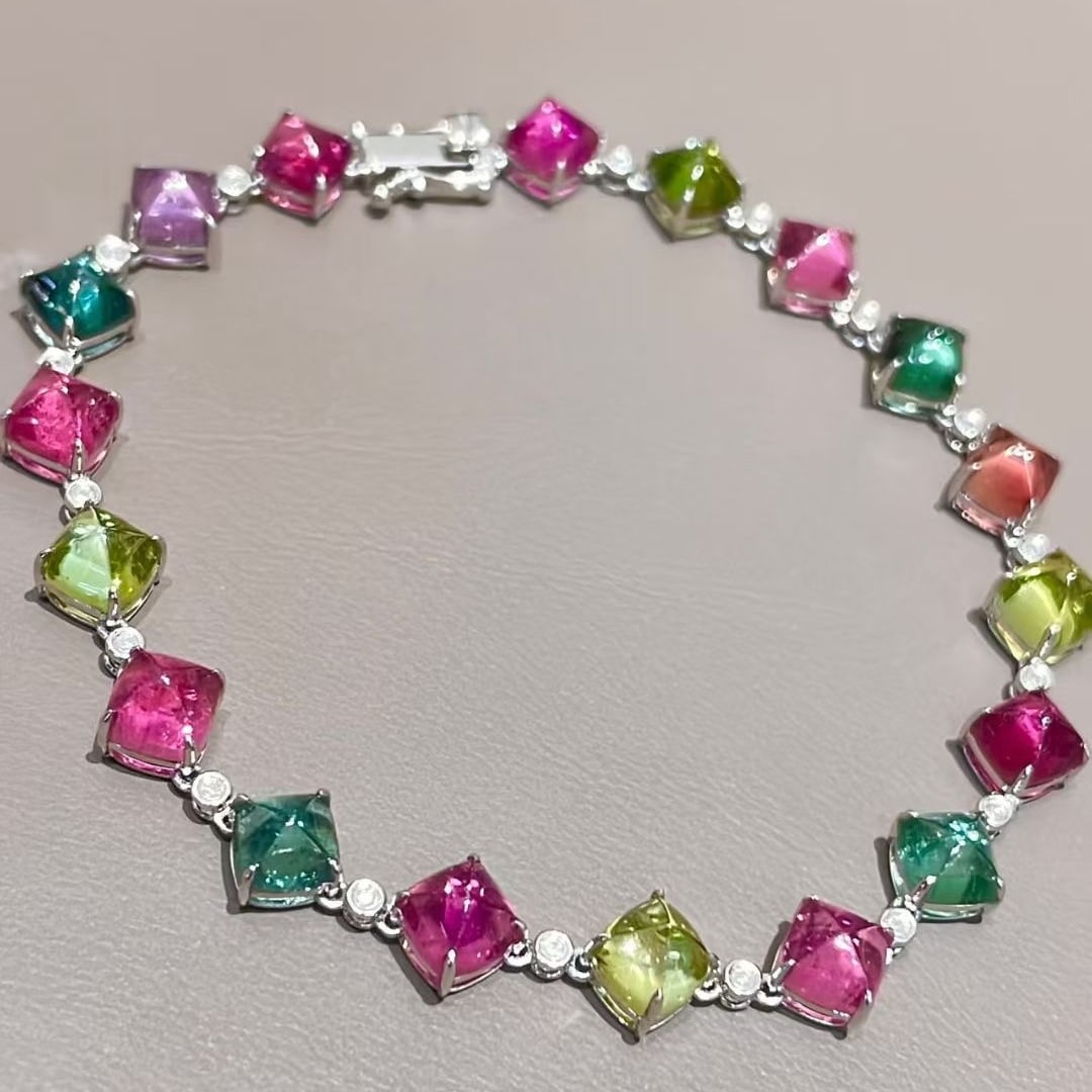 14k Gold 13.2 Ct Natural Tourmaline & Diamond Bracelet: Ref:231073015 // gold content:14k gold // main gemstone:tourmaline // shape:sugar-loaf // carat weight:13. 2ct // color:color // treatment:natural // // adjacent gemstone 2 : diamond // shape:round