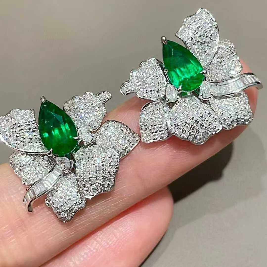 14k Gold 3.05 Ctw Vivid Green Natural Emerald & Diamond Earrings: Ref:231073181 // gold content:14k gold // main gemstone:emerald // shape:pear // carat weight:1. 65ct // color:vivid green // treatment:natural // // adjacent gemstone 2 : diamond // shape:multiple