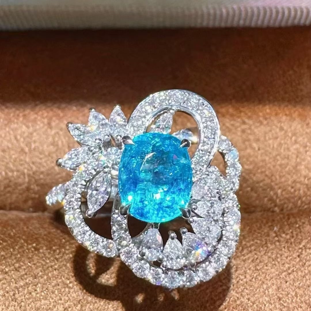 14k Gold 2.12 Ctw Natural Paraiba Tourmaline & Diamond Ring: Ref:231073200 // gold content:14k gold // ring size:7. 25us // // main gemstone:paraiba tourmaline // shape:oval // carat weight:1. 23ct // color:blue // treatment:natural // // adjacent gemstone 2 :