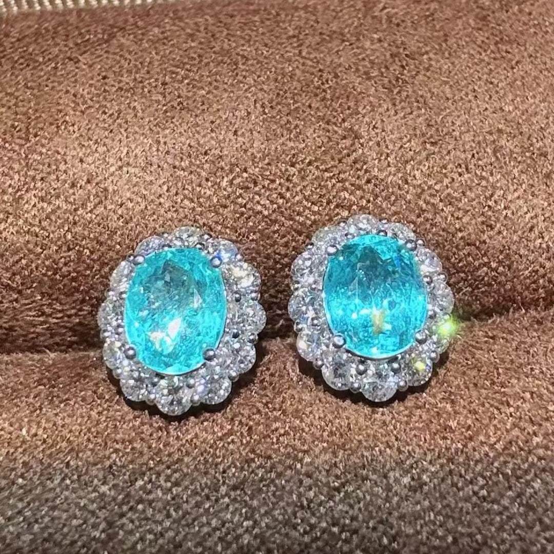 14k Gold 2.30 Ctw Natural Paraiba Tourmaline & Diamond Earrings: Ref:231073244 // gold content:14k gold // main gemstone:paraiba tourmaline // shape:oval // carat weight:1. 58ct // color:blue // treatment:natural // // adjacent gemstone 2 : diamond // shape:round