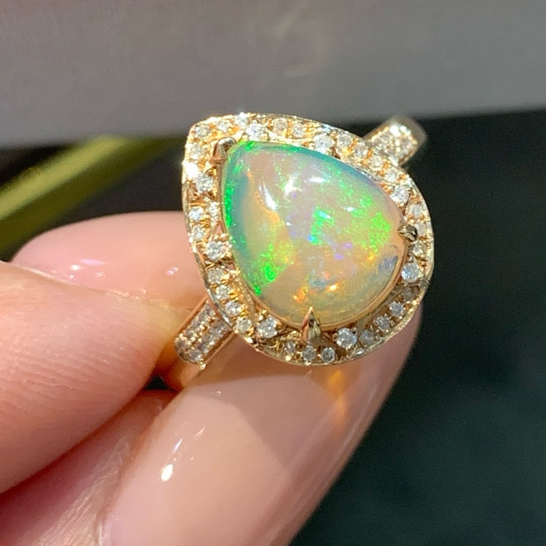 14k Gold 1.74 Ctw Natural Opal & Diamond Ring: Ref:231074161 // gold content:14k gold // ring size:7. 25us // // main gemstone:opal // shape:pear // carat weight:1. 19ct // color:color // treatment:natural // // adjacent gemstone 2 : diamond //