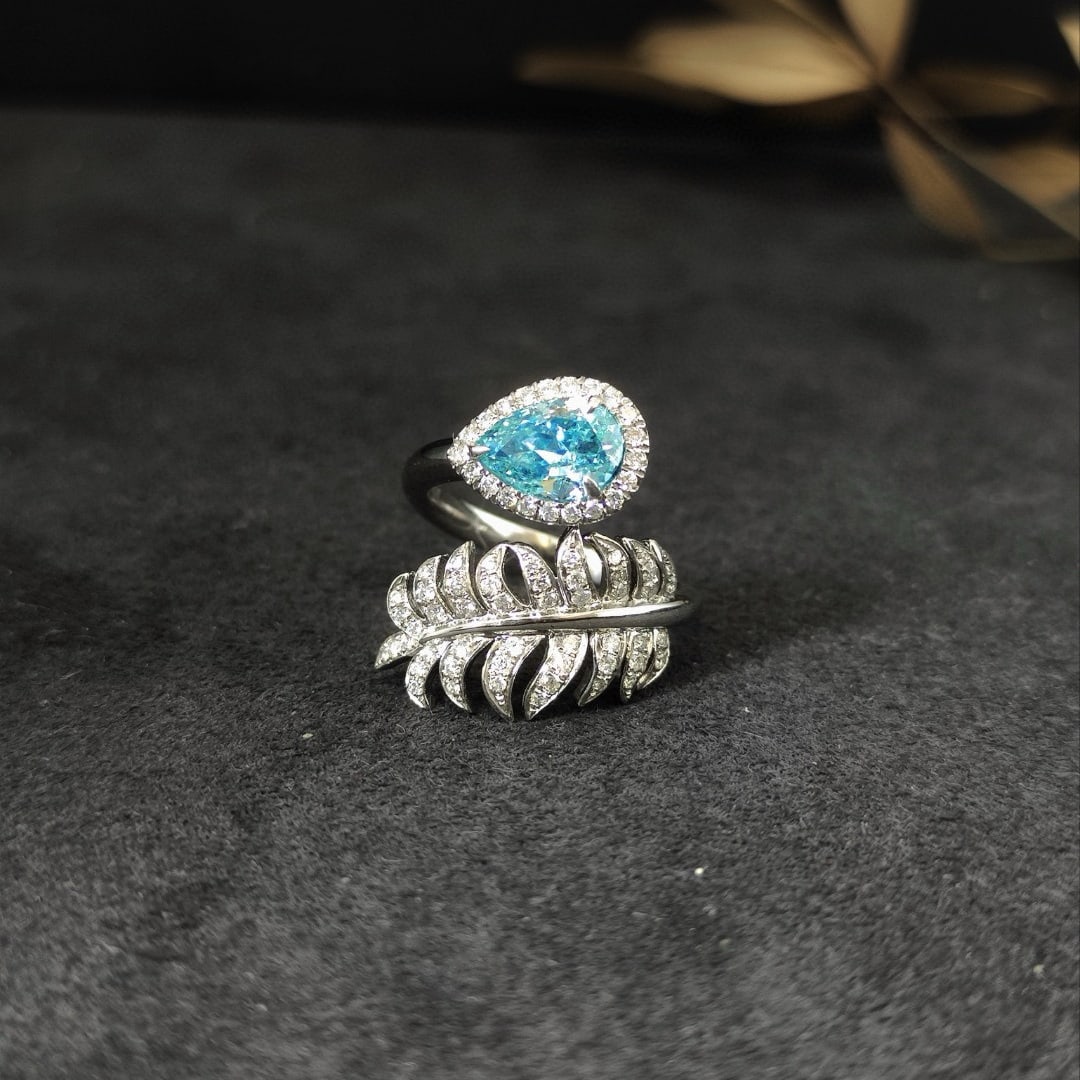 14k Gold 1.42 Ctw Natural Blue Diamond & Diamond Ring: Ref:231074251 // gold content:14k gold // ring size:7. 25us // // main gemstone:blue diamond // shape:pear // carat weight:1. 01ct // color:blue // treatment:natural // // adjacent gemstone 2 :