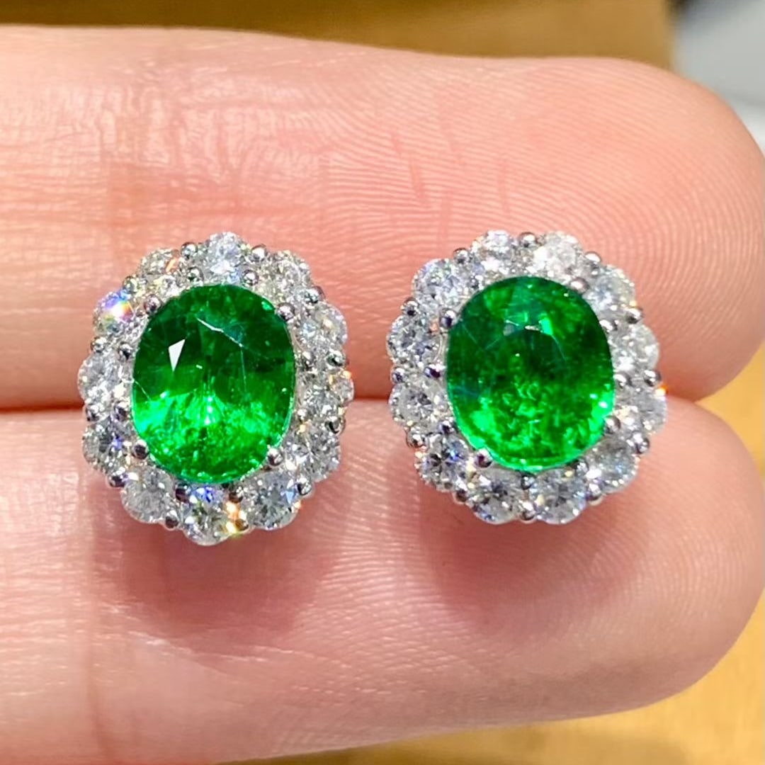14k Gold 2.2 Ct Natural Tsavorite & Diamond Earrings: Ref:231075205 // gold content:14k gold // main gemstone:tsavorite // shape:oval // carat weight:2. 2ct // color:green // treatment:natural // // adjacent gemstone 2 : diamond // shape:round //