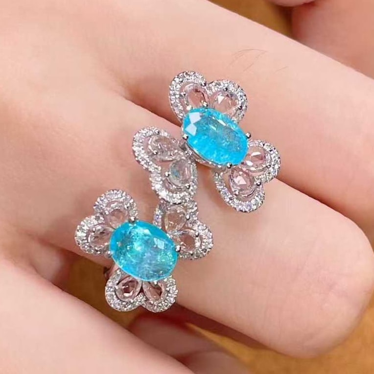 14k Gold 2.13 Ctw Natural Paraiba Tourmaline & Sapphire Ring: Ref:231075207 // gold content:14k gold // ring size:7. 25us // // main gemstone:paraiba tourmaline // shape:oval // carat weight:1. 2ct // color:blue // treatment:natural // // adjacent gemstone 2 : s