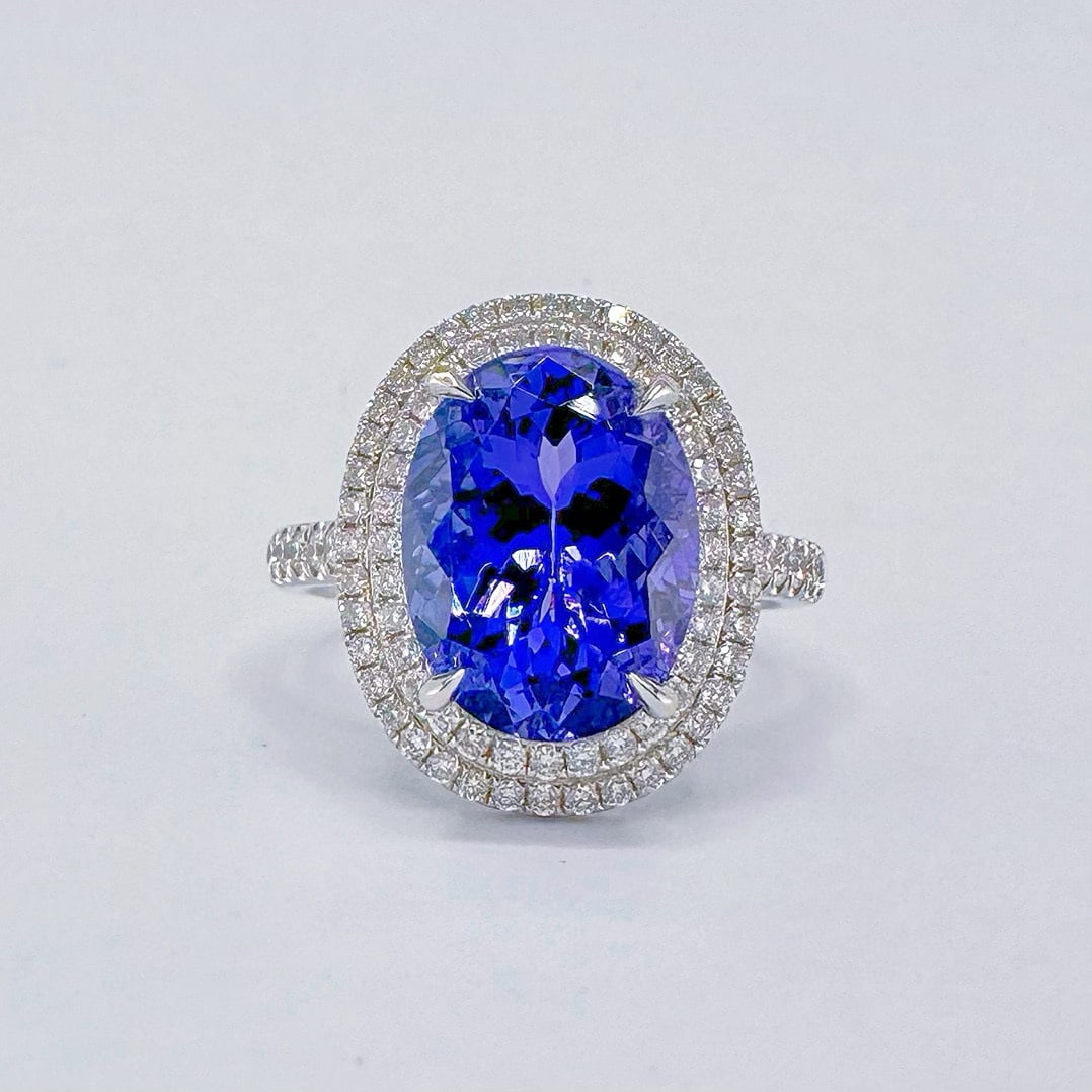 14k Gold 5.65 Ctw Natural Tanzanite & Diamond Ring: Ref:231076037 // gold content:14k gold // ring size:7. 25us // // main gemstone:tanzanite // shape:oval // carat weight:5. 11ct // color:blue // treatment:natural // // adjacent gemstone 2 : diamond