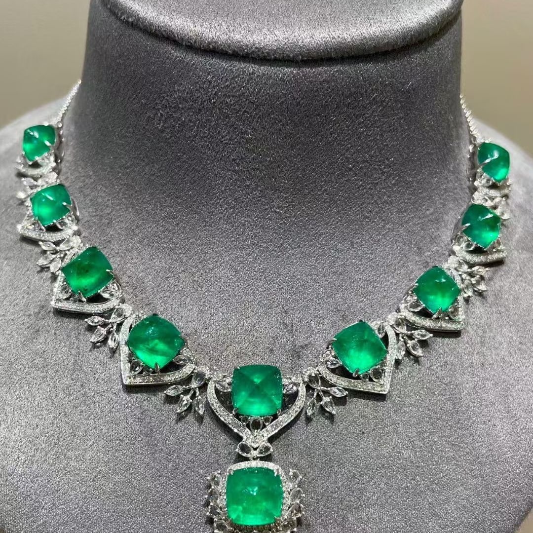 14k Gold 22.1 Ct Natural Emerald & Diamond & Sapphire Necklace: Ref:231083006 // gold content:14k gold // main gemstone:emerald // shape:sugar-loaf // carat weight:22. 1ct // color:green // treatment:natural // // adjacent gemstone 2 : diamond // shape:round //