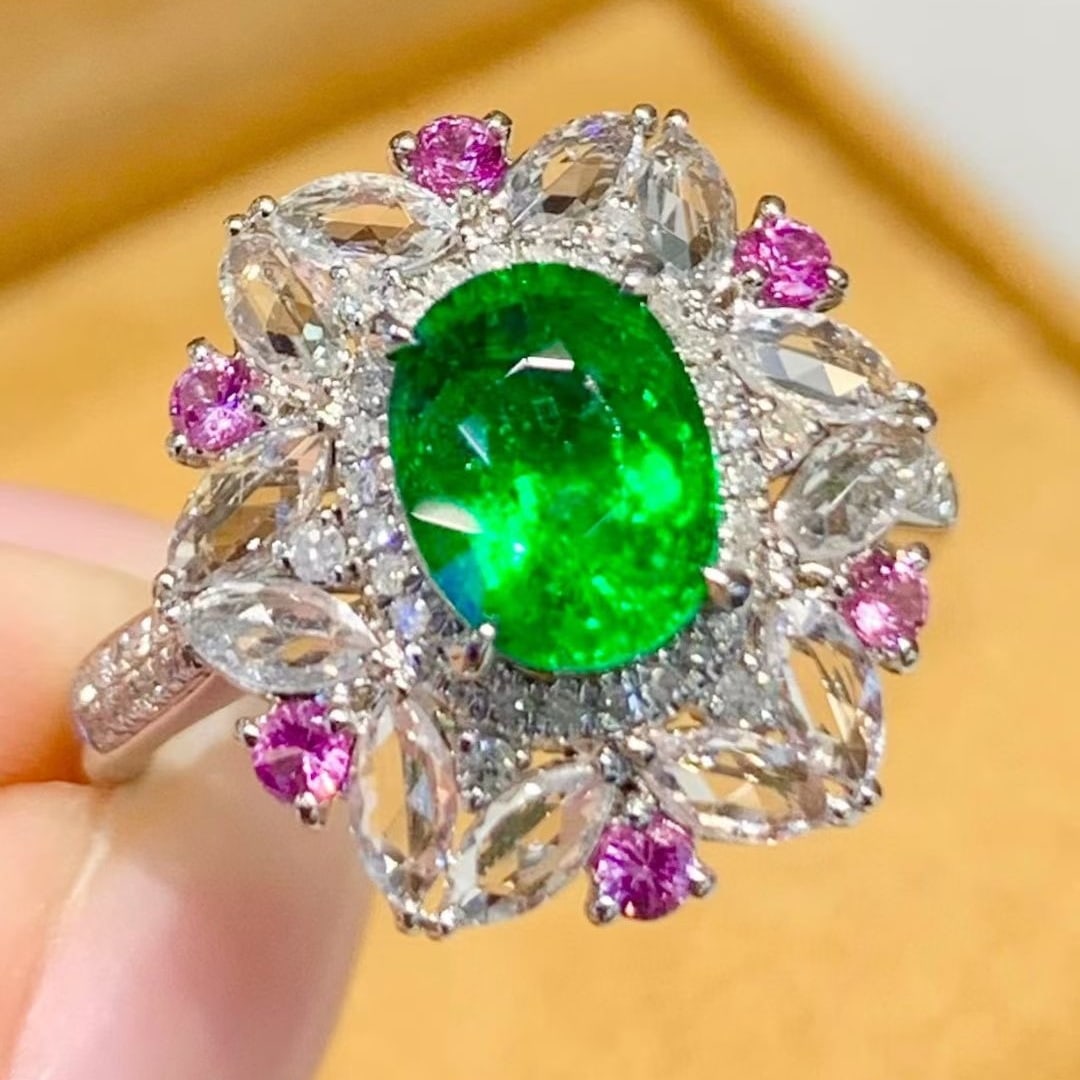 14k Gold 1.65 Ct Natural Tsavorite & Diamond & Coloured Gemstone Ring: Ref:231083012 // gold content:14k gold // ring size:7. 25 us // // main gemstone:tsavorite // shape:oval // carat weight:1. 65ct // color:green // treatment:natural // // adjacent gemstone 2 :