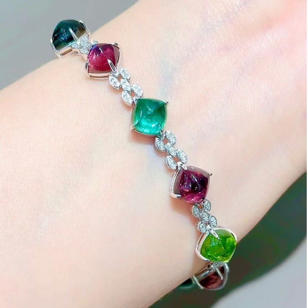 14k Gold 18 Ct Natural Tourmaline & Diamond Bracelet: Ref:231083015 // gold content:14k gold // main gemstone:tourmaline // shape:sugar-loaf // carat weight:18ct // color:color // treatment:natural // // adjacent gemstone 2 : diamond // shape:round //