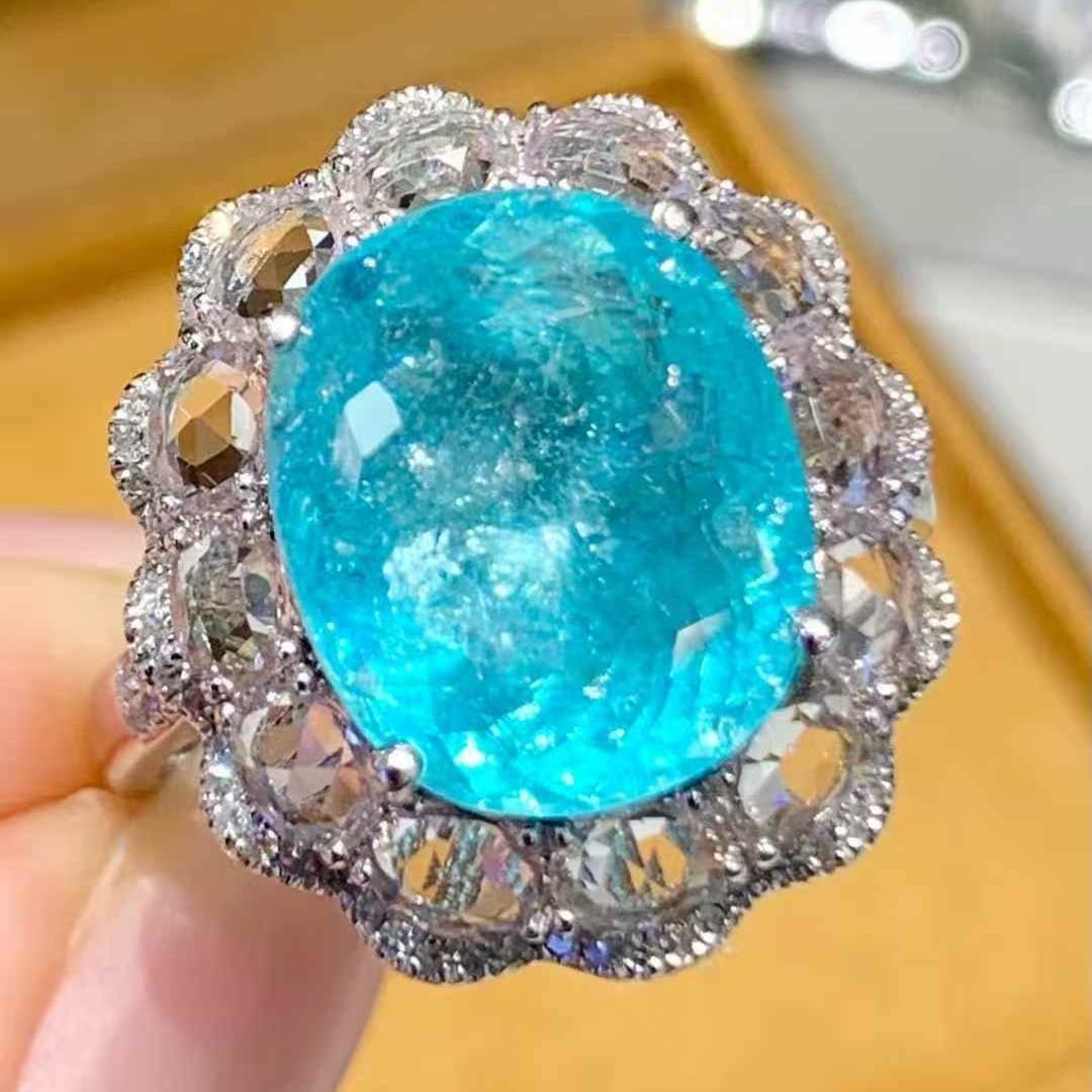 14k Gold 6.2 Ct Natural Paraiba Tourmaline & Sapphire & Diamond Ring: Ref:231083046 // gold content:14k gold // ring size:7. 25 us // // main gemstone:paraiba tourmaline // shape:oval // carat weight:6. 2ct // color:blue // treatment:natural // // adjacent gemstone 2 :
